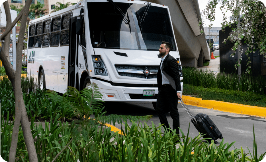 Executive in front of Traxion's transportation bus