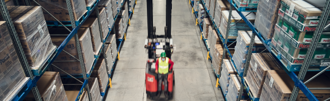 Traxion forklift in the middle of a warehouse