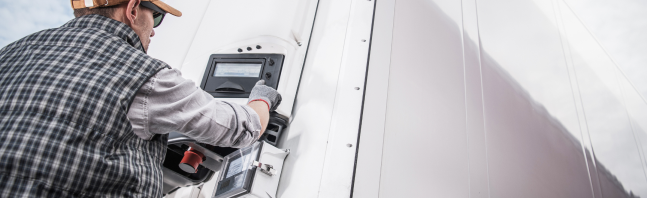 Man adjusting refrigerated traxion charge